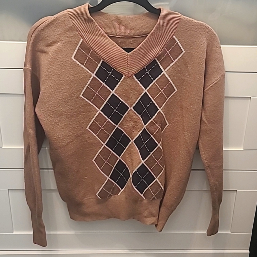 Brown, black, and white checked pattern sweater in a size small, brand unknown